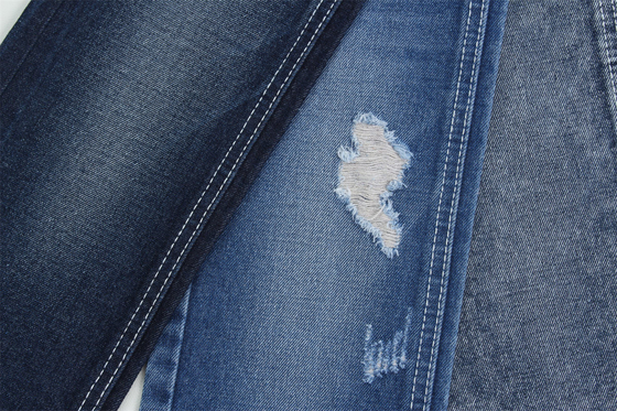 12.1 Oz Buat pagar 3x1 tangan kanan dengan tekstur permukaan yang kaya Katun Polyester Spandex Jeans Tekstil TR Kain Denim