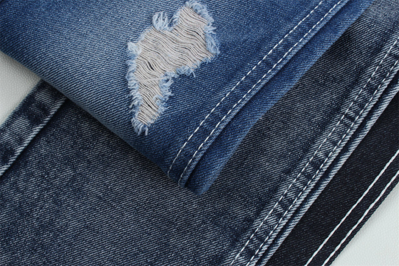 12.1 Oz Buat pagar 3x1 tangan kanan dengan tekstur permukaan yang kaya Katun Polyester Spandex Jeans Tekstil TR Kain Denim